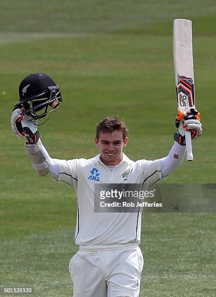 Tom Latham of New Zealand celebrates scoring 100 runs during day four of the First Test match between New Zealand and Sri Lanka at University Oval on...