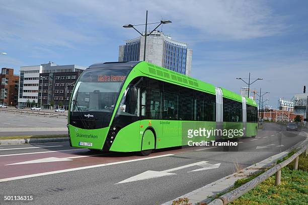 van hool exqui.city tram-bus on the road - biogas stock pictures, royalty-free photos & images