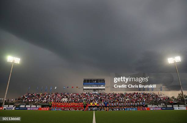 Argentina and China line up for the national anthems ahead of their match during Day 8 of the Hockey World League Final Rosario 2015 at El Estadio...