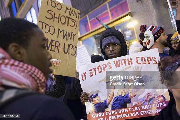 Demonstrators march through downtown on December 12, 2015 in Chicago, Illinois. A recently released video showing the shooting of teenager Laquan...