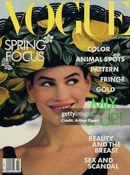 Model Carré Otis on the cover of Vogue magazine wearing a straw hat with lemon-print lining by Options for Byblos.