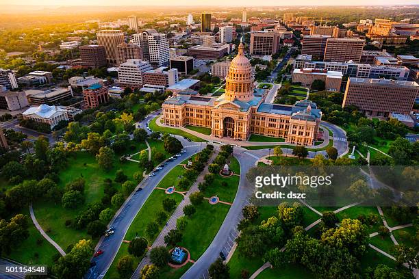 capitol building, aerial skyline, sunset, austin, tx,  texas state capital - local government building stockfoto's en -beelden