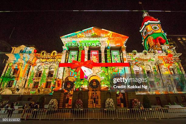 christmas projection on melbourne town hall - melbourne lights stock pictures, royalty-free photos & images