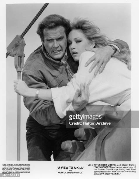 Actor Roger Moore grabs into Tanya Roberts in a scene of the MGM/UA movie "A View to a Kill" circa 1984.