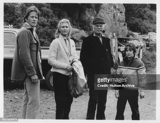 Peter Strauss, Dee Wallace, Richard Widmark and David Hollander look on the beach in the Television movie "A Whale for the Killing" circa 1981.