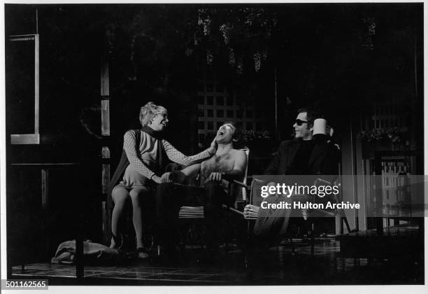 Actress Barbara Barrie and Dean Jones laugh on stage during the stage play of "Company" in New York.
