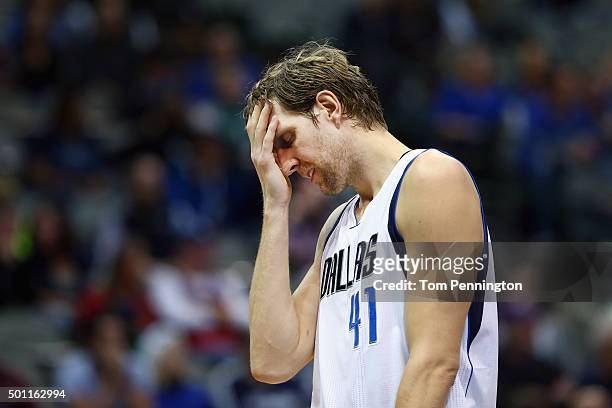 Dirk Nowitzki of the Dallas Mavericks reacts against the Washington Wizards in the fourth quarter at American Airlines Center on December 12, 2015 in...