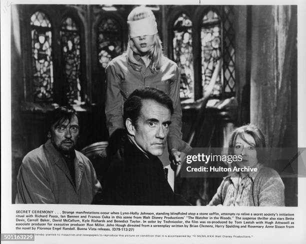 Richard Pasco, Lynn-Holly Johnson, Ian Bannen and Frances Cuka perform a ritual in a scene for the Walt Disney movie "The Watcher in the Woods" circa...