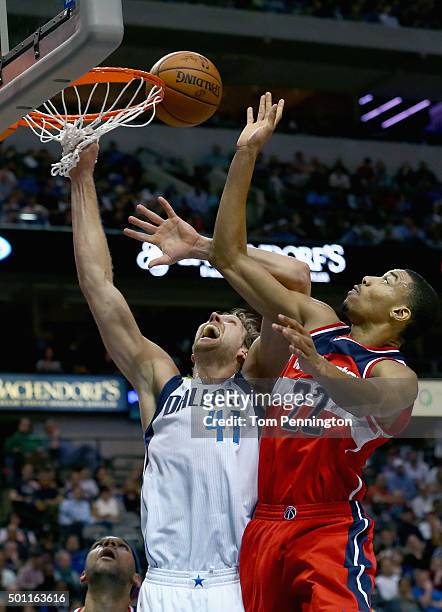 Otto Porter Jr. #22 of the Washington Wizards shoots the ball against Dirk Nowitzki of the Dallas Mavericks at American Airlines Center on December...
