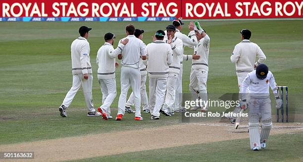 Tim Southee of New Zealand is congratulated on the dismissal of Kusal Mendis of Sri Lanka by his team-mates during day four of the First Test match...