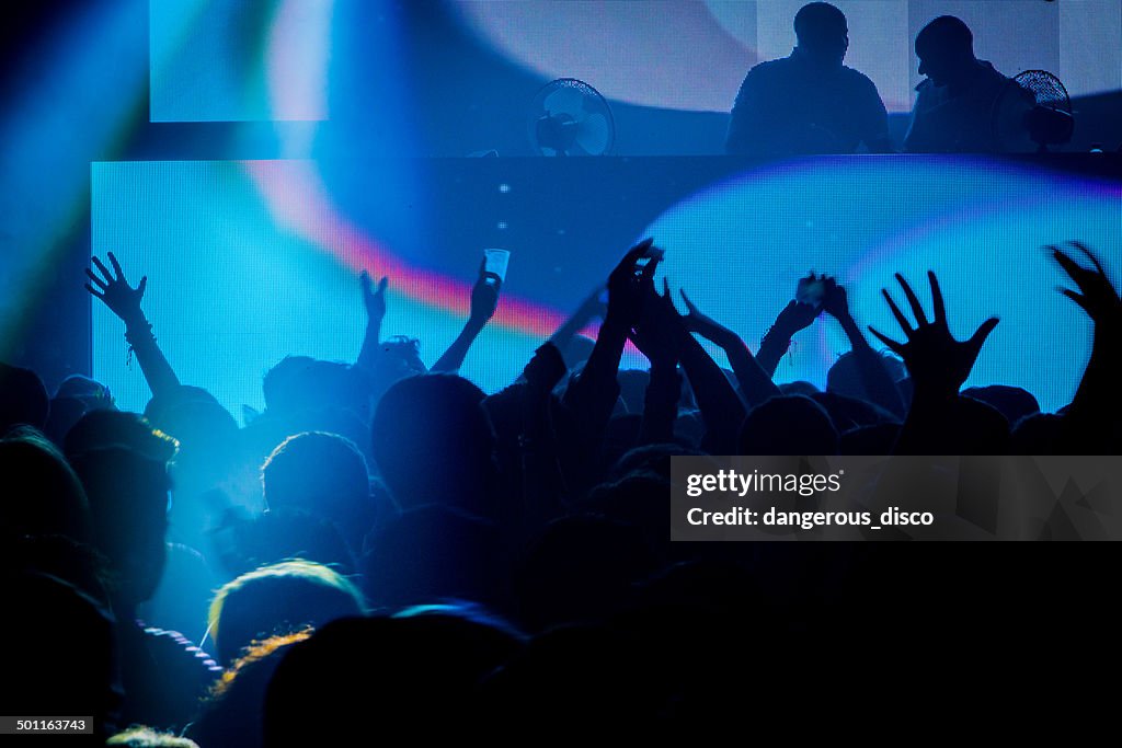 People dancing in a busy night club