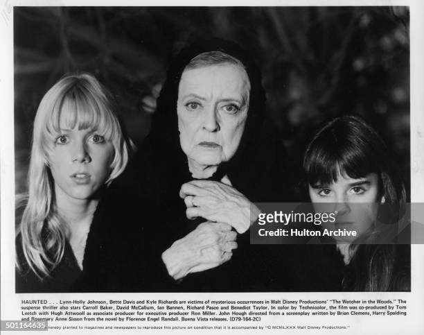 Lynn-Holly Johnson, Bette Davis and Kyle Richards look scared in a scene for the Walt Disney movie "The Watcher in the Woods" circa 1979.