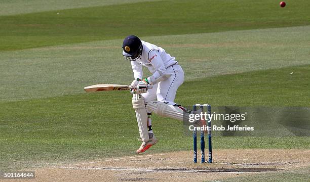 Dinesh Chandimal of Sri Lanka takes evasive action to a bouncer during day four of the First Test match between New Zealand and Sri Lanka at...