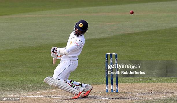 Dinesh Chandimal of Sri Lanka ducks out of the way of a bouncer from Neil Wagner of New Zealand during day four of the First Test match between New...