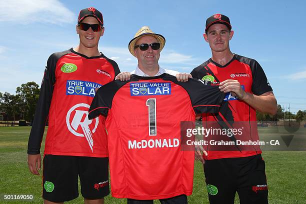 Mayor Cameron McDonald is presented a shirt by Chris Tremain and Tom Beaton of the Renegades during the Melbourne Renegades Big Bash League fan day...