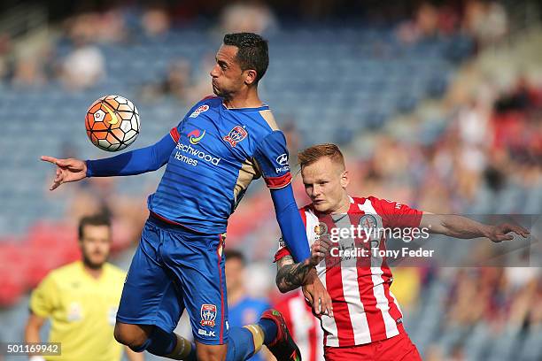 Milos Trifunovic of the Jets controls the ball from Jack Clisby of Melbourne Cityduring the A-League match between the Newcastle Jets and Melbourne...