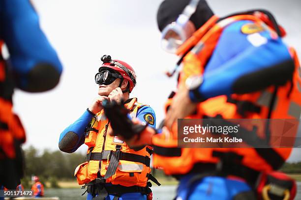Volunteers prepare to take to the water during a SES helicopter-based water rescue training exercises at Penrith Whitewater Centre on December 13,...