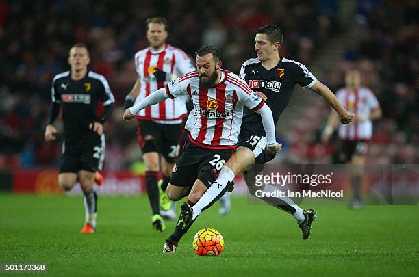 Steven Fletcher of Sunderland vies with Craig Cathcart of Watford during the Barclays Premier League match between Sunderland and Watford at The...