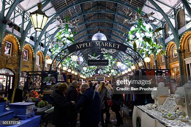 The ceiling of Covent Garden Market is lined with giant mistletoe as part of it's Christmas light display on December 8, 2015 in London, England....