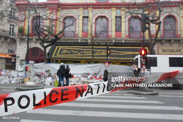 Police cordon is seen in front of the music hall Bataclan in Paris on December 13 a month after the Paris terror attacks on November 13, 2015. France...