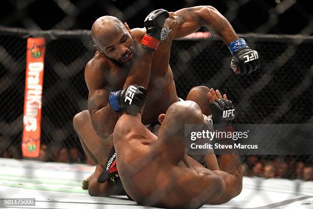 Yoel Romero punches Ronaldo Souza in a middleweight fight during UFC 194 at MGM Grand Garden Arena on December 12, 2015 in Las Vegas, Nevada.