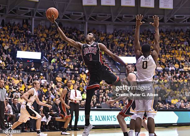 Forward Derrick Jones Jr. #1 of the UNLV Rebels drives to the basket past forward Rashard Kelly of the Wichita State Shockers during the second half...