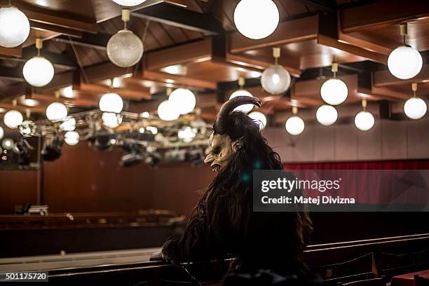 Participant dressed as the Krampus creature rests in the backstage before Krampus gathering on December 12, 2015 in Kaplice, Czech Republic. Krampus,...