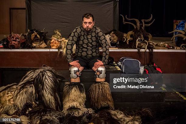 Participant dressed as the Krampus creature rests in the backstage before Krampus gathering on December 12, 2015 in Kaplice, Czech Republic. Krampus,...