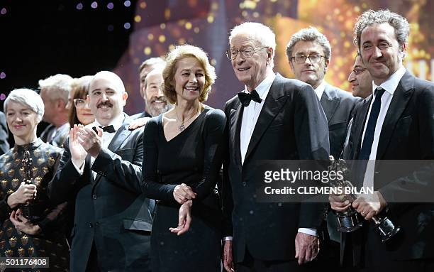 The winners British actress Charlotte Rampling , British actor Sir Michael Caine and Italian directo Paolo Sorrentino pose with their awards on stage...