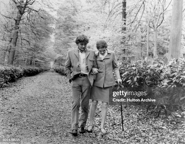 David Hemmings helps Samantha Eggar walk in a scene of the movie "The Walking Stick" circa 1970.