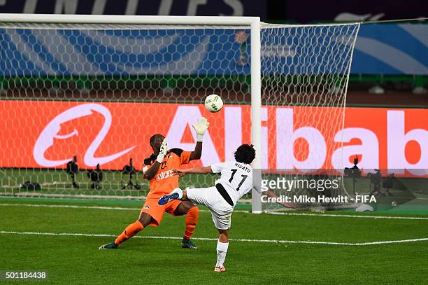 Hisato Sato of Sanfrecce blasts an early chance over the bar with only goalkeeper Sylvain Gbohouo of Mazemba to beat during the FIFA Club World Cup...