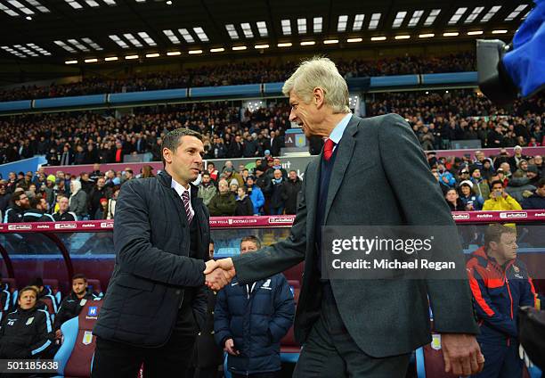 Remi Garde of Aston Villa and Arsene Wenger manager of Arsenal shake hands prior to the Barclays Premier League match between Aston Villa and Arsenal...