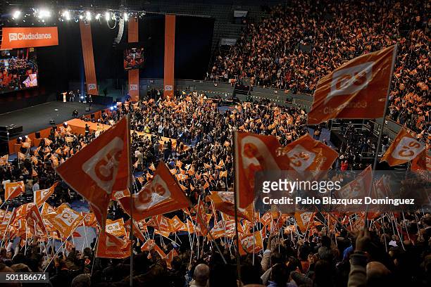 Albert Rivera, leader of Ciudadanos 'Citizens' stands on stage as his supporters wave Ciudandanos' flags during a campaign rally at Palacio de...