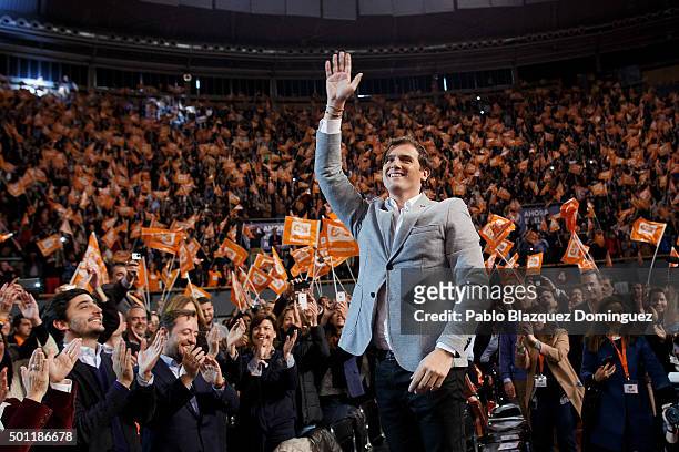 Albert Rivera , leader of Ciudadanos wave his hand to his supporters as he stands on a chair during a campaign rally at Palacio de Vistalegre on...
