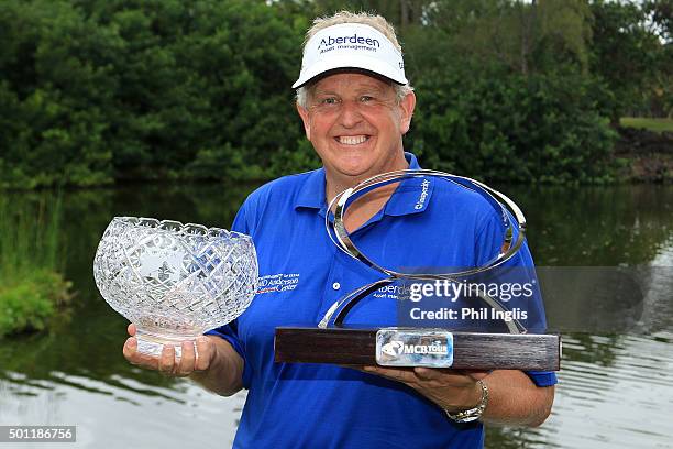 Colin Montgomerie of Scotland poses with the MCB trophy and the John Jacobs trophy for winning the Order of Merit 2015 after the final round of the...