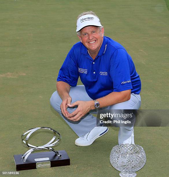 Colin Montgomerie of Scotland poses with the MCB trophy and the John Jacobs trophy for winning the Order of Merit 2015 after the final round of the...