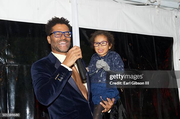 Singer/Songwriter Eric Benet and his daughter Lucia Bella share the microphone at the In A Perfect World 10 Year Celebration Of Giving on December...