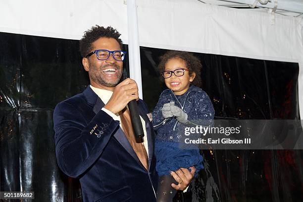 Singer/Songwriter Eric Benet and his daughter Lucia Bella share the microphone at the In A Perfect World 10 Year Celebration Of Giving on December...