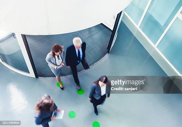 rush hour with business people - entering stock pictures, royalty-free photos & images