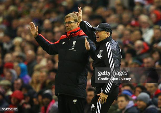 Tony Pulis manager of West Bromwich Albion and Jurgen Klopp, manager of Liverpool react during the Barclays Premier League match between Liverpool...