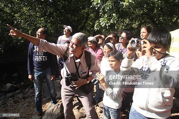 People participate in Kaun Banega Ornithologist program at Sanjay Gandhi National Park, Borivali during a "No TV Day" weekend fest organized by...