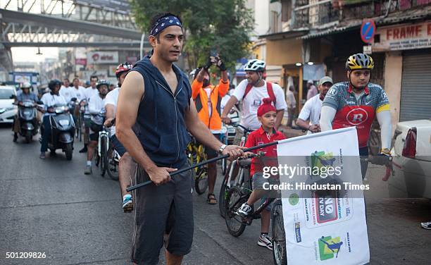 Mumbaikars participate in a cyclothon from Bandra to Goregoan during a "No TV Day" weekend fest organized by Hindustan Times, on December 12, 2015 in...