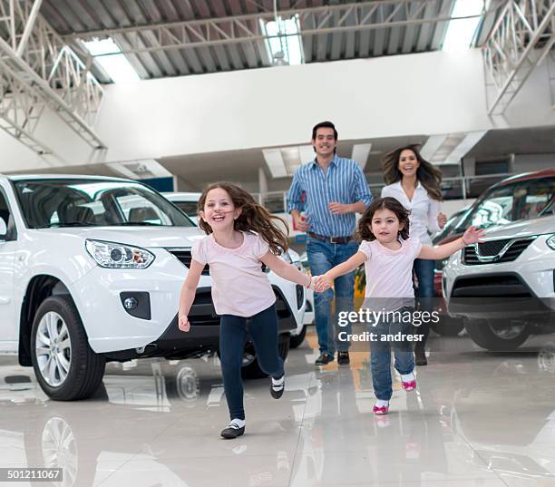 family buying a car - car exhibition stock pictures, royalty-free photos & images