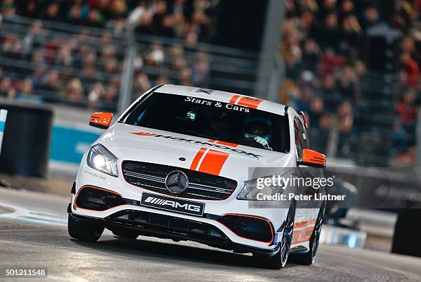 Jean Alesi with the Mercedes AMG A45 racing at Mercedes-Benz Arena on December 12, 2015 in Stuttgart, Germany. Jean Alesi