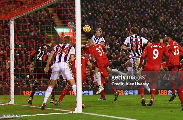 Jonas Olsson of West Bromwich Albion scores their second goal during the Barclays Premier League match between Liverpool and West Bromwich Albion at...