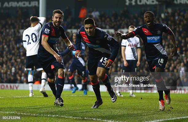 Aleksandar Mitrovic of Newcastle United celebrates with Paul Dummett and Chancel Mbemba as he scores their first and equalising goal during the...