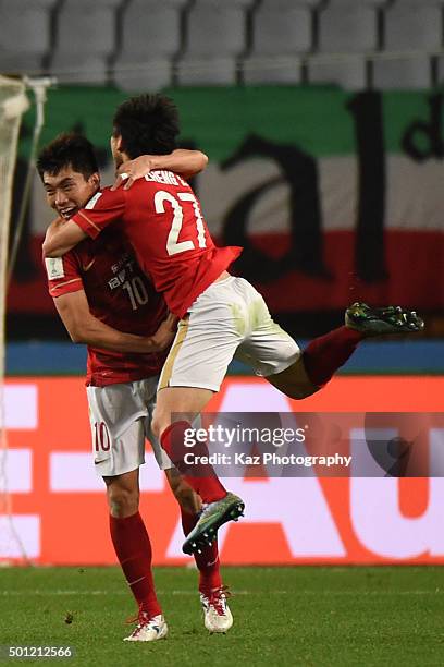 Zheng Long of Guangzhou Evergrande FC celebrates the equaliser with Zhneg Zhi of Guangzhou Evergrande FC during the FIFA Club World Cup quarter final...