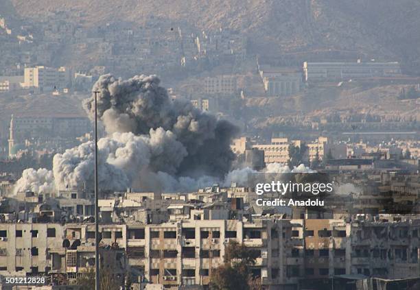 Smoke rises after the war crafts belonging to the Russian Army carried out airstrikes on opposition-controlled Douma district of eastern Ghouta,...