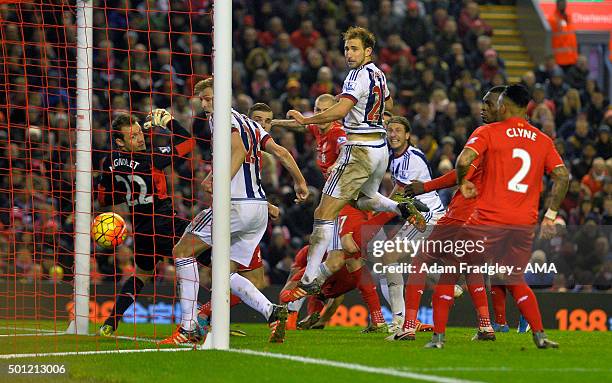 Jonas Olsson of West Bromwich Albion scores a goal to make it 1-2 during the Barclays Premier League match between Liverpool and West Bromwich Albion...