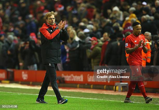 Jurgen Klopp, manager of Liverpool and Nathaniel Clyne applaud the crowd after the Barclays Premier League match between Liverpool and West Bromwich...